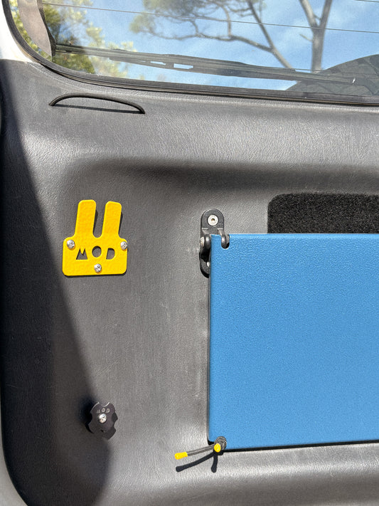 Bottle Pouch Slide installed in yellow on Jimny rear door