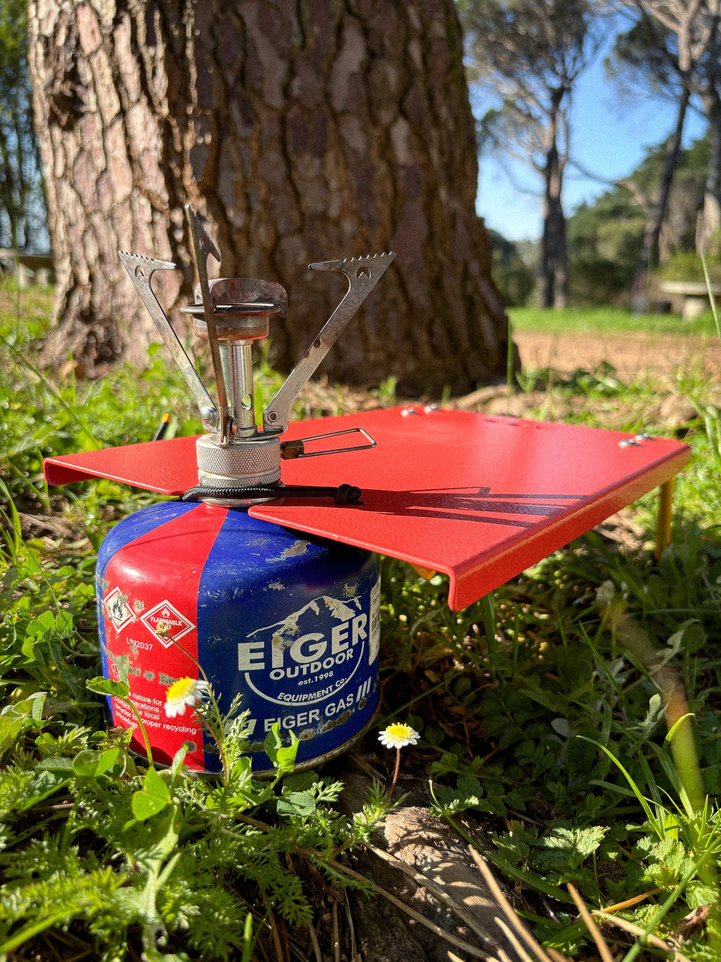 Camp Stove Table in Traffic Red showing how the gas canister connects