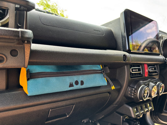 Dash Pouch installed in Jimny 4 dash console in teal and yellow