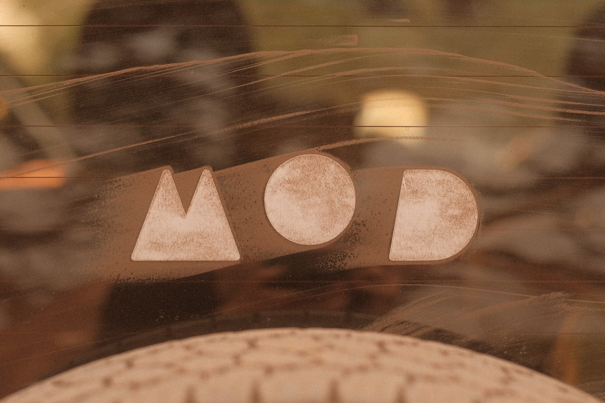 Dusty MOD logo on the back window of a Jimny