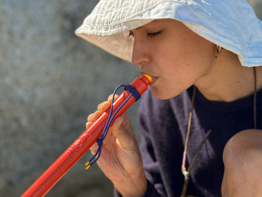 Firestick in Red, a woman showing the mouth piece detail