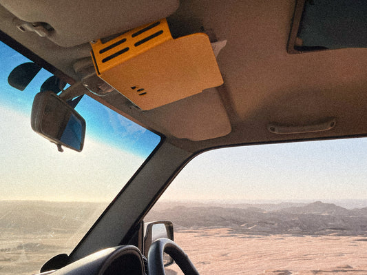 Headroom in Jimny 3 in Yellow showing storage of glasses and maps