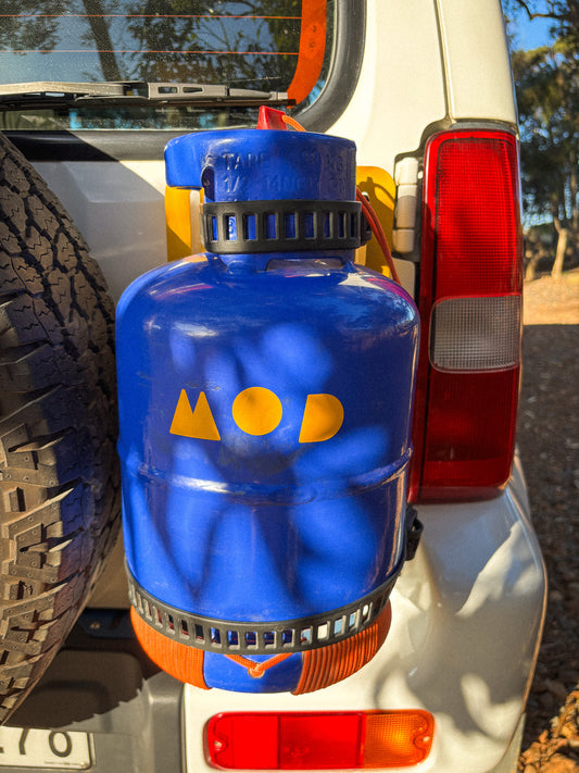 MOD sticker on a gas canister on rear door mount on Jimny 3