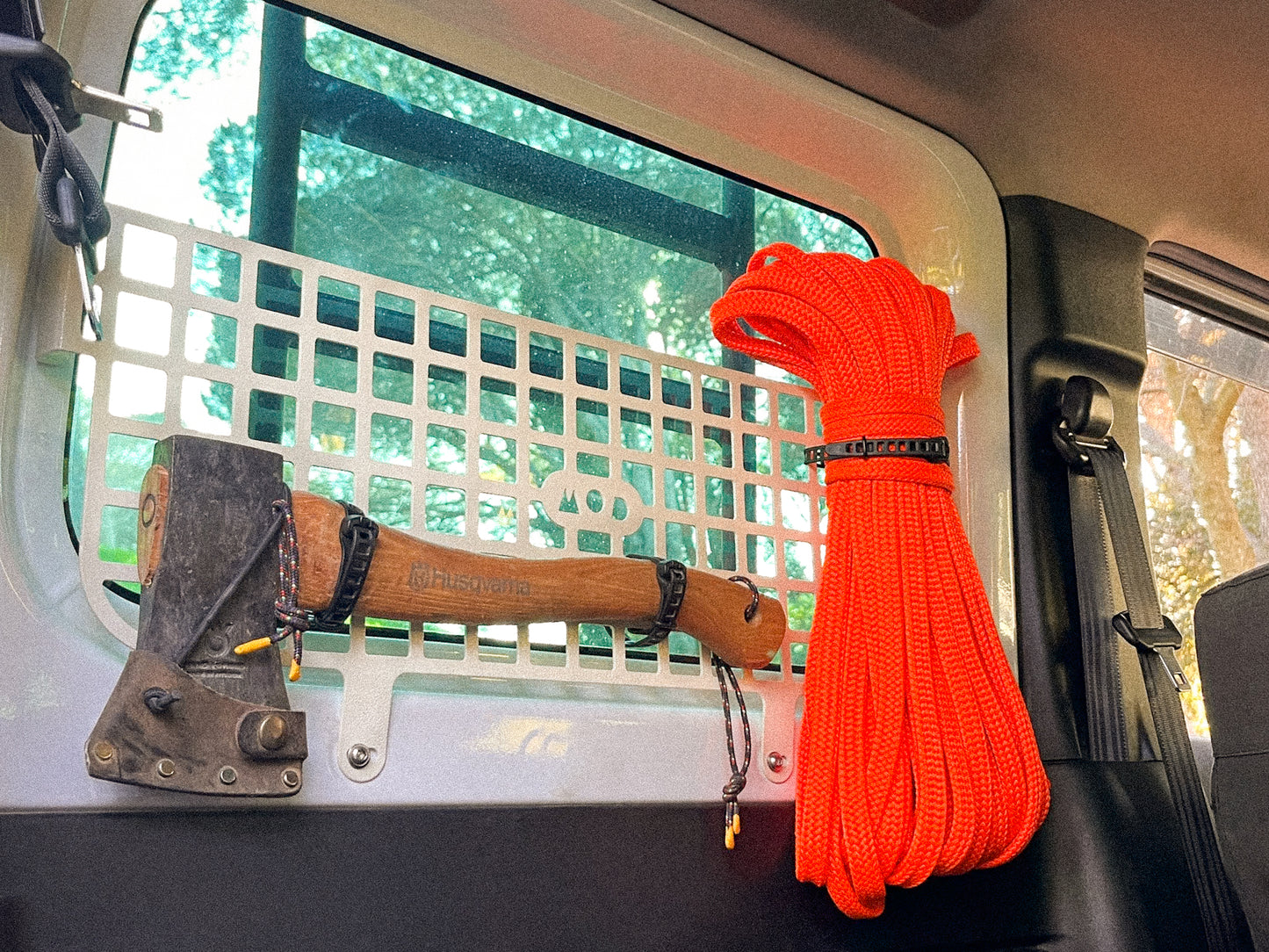 Molle panel in Jimny rear window with axe and storage