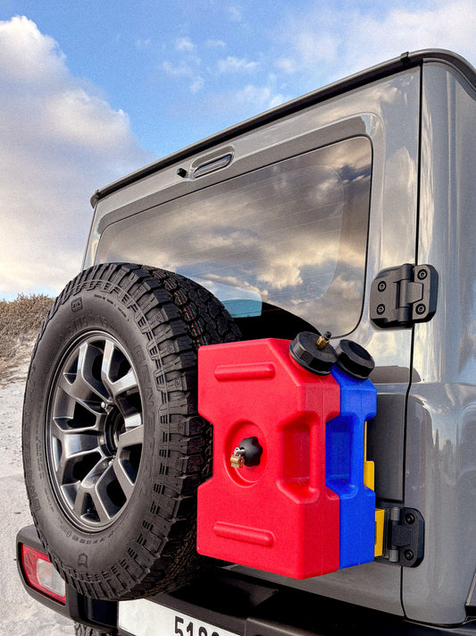 Rear Door Mount showing fuel tanks on the back of a Jimny carrying extra cargo