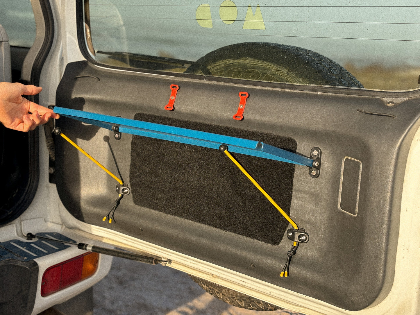 Rear Door Table in Blue in a Jimny 3 showing the pop-up