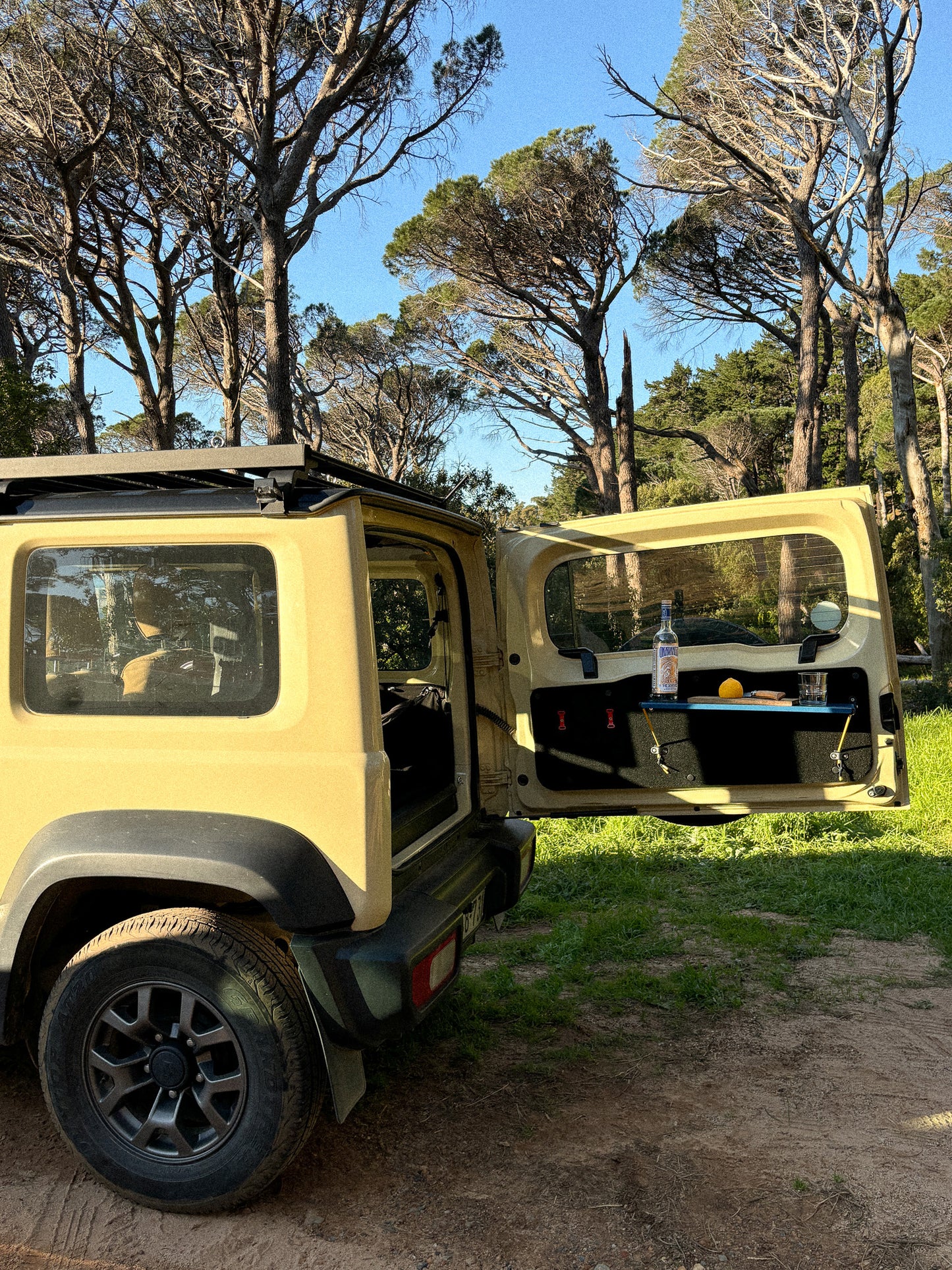 Rear Door Table in Blue with drinks set up in a Jimny 4 and Utility Panel
