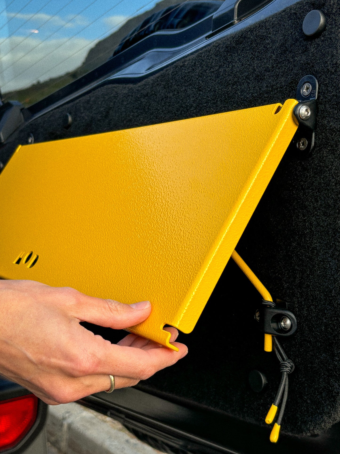 Rear Door Table in Yellow in a Jimny 4 showing pop-up table