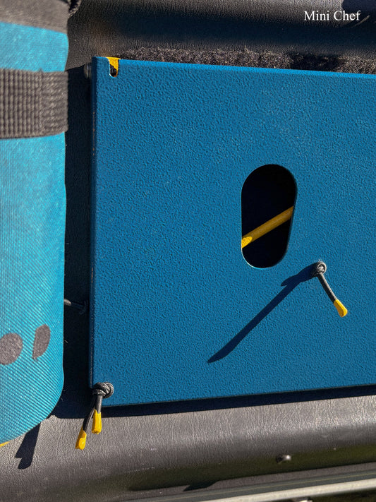 Close up of keyhole slot for butane gas canister in the rear door table top mounted in a Suzuki Jimny