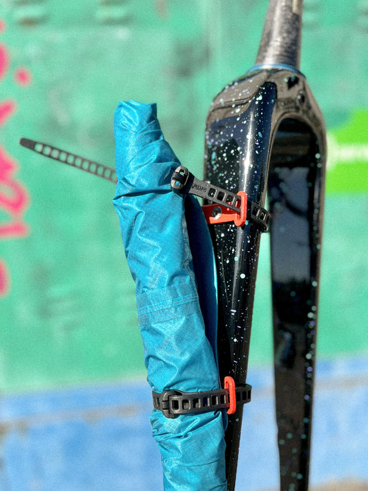 MOD StrapOnz with SoftTie strap mounted on a bicycle fork tied with cargo