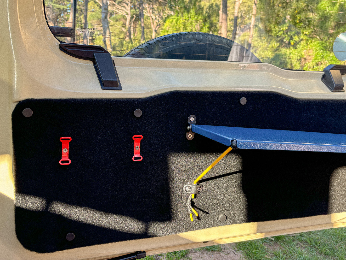 StrapOnz and Rear Door Table on the Utility Panel in the Jimny 4