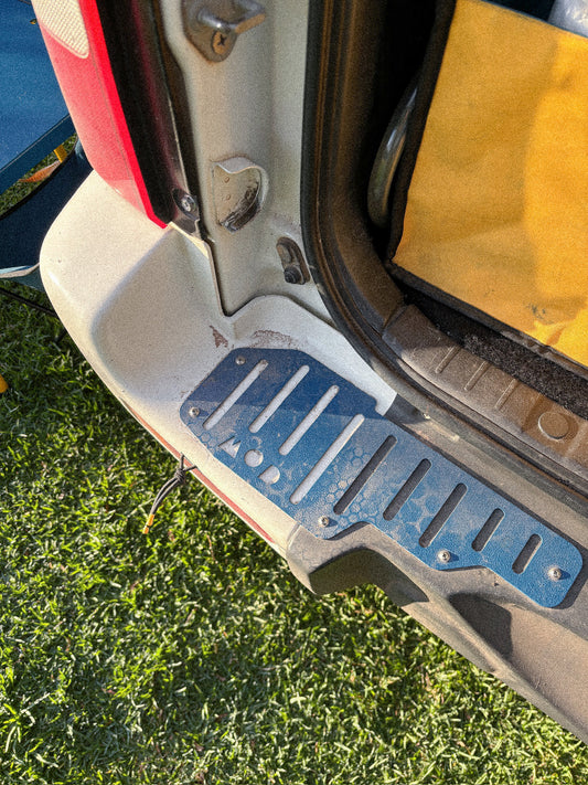 Tread Plates in Blue mounted on a Jimny 3 rear bumper for protection