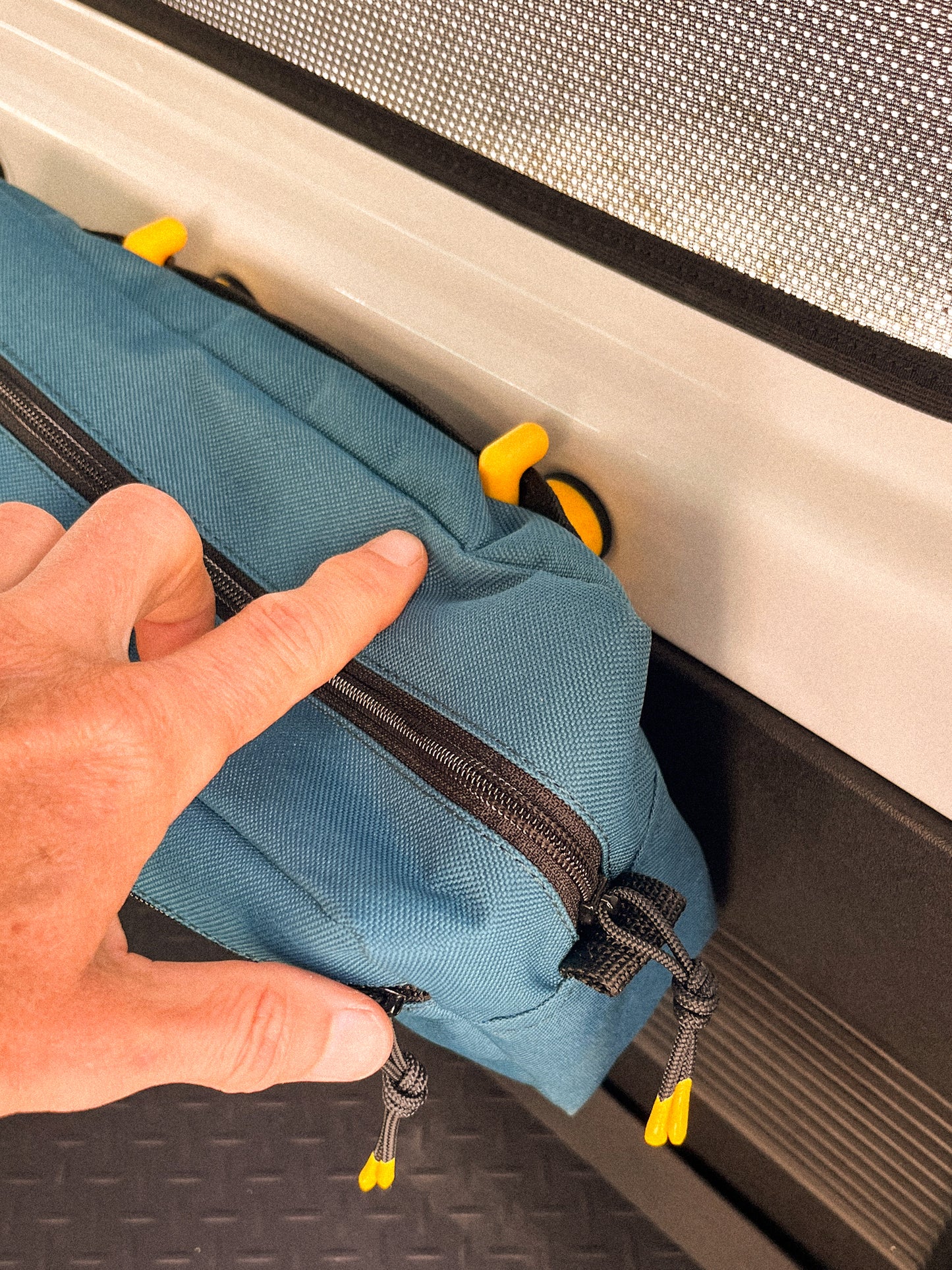 Detail of bag hooked onto Hook & Loop set in the back of a Suzuki Jimny 4