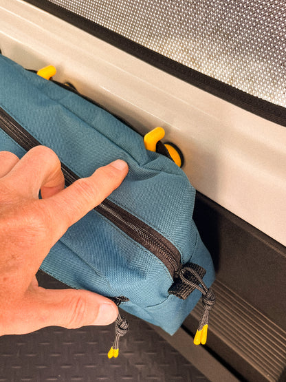 Detail of bag hooked onto Hook & Loop set in the back of a Suzuki Jimny 4