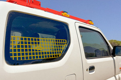 Jimny 3 with rear window molle installed showing from the outside