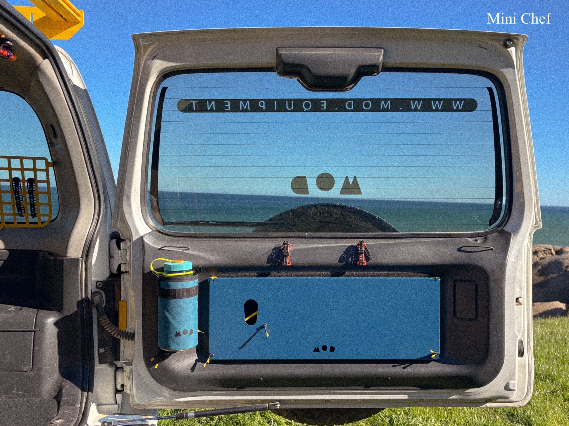 Rear Door Table for Jimny 3 folded down and stowed away neatly on the rear door 