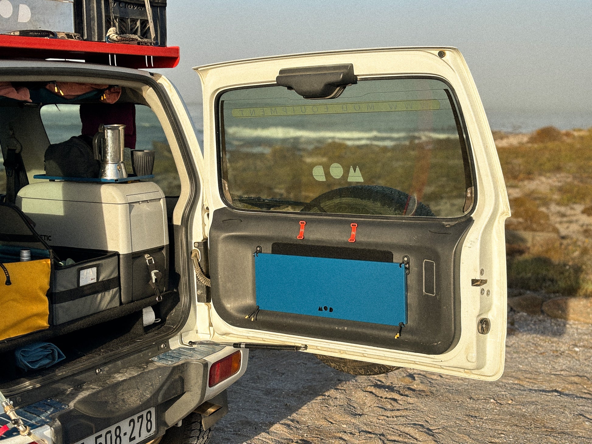 Rear Door Table in Blue in a Jimny 3 closed neatly