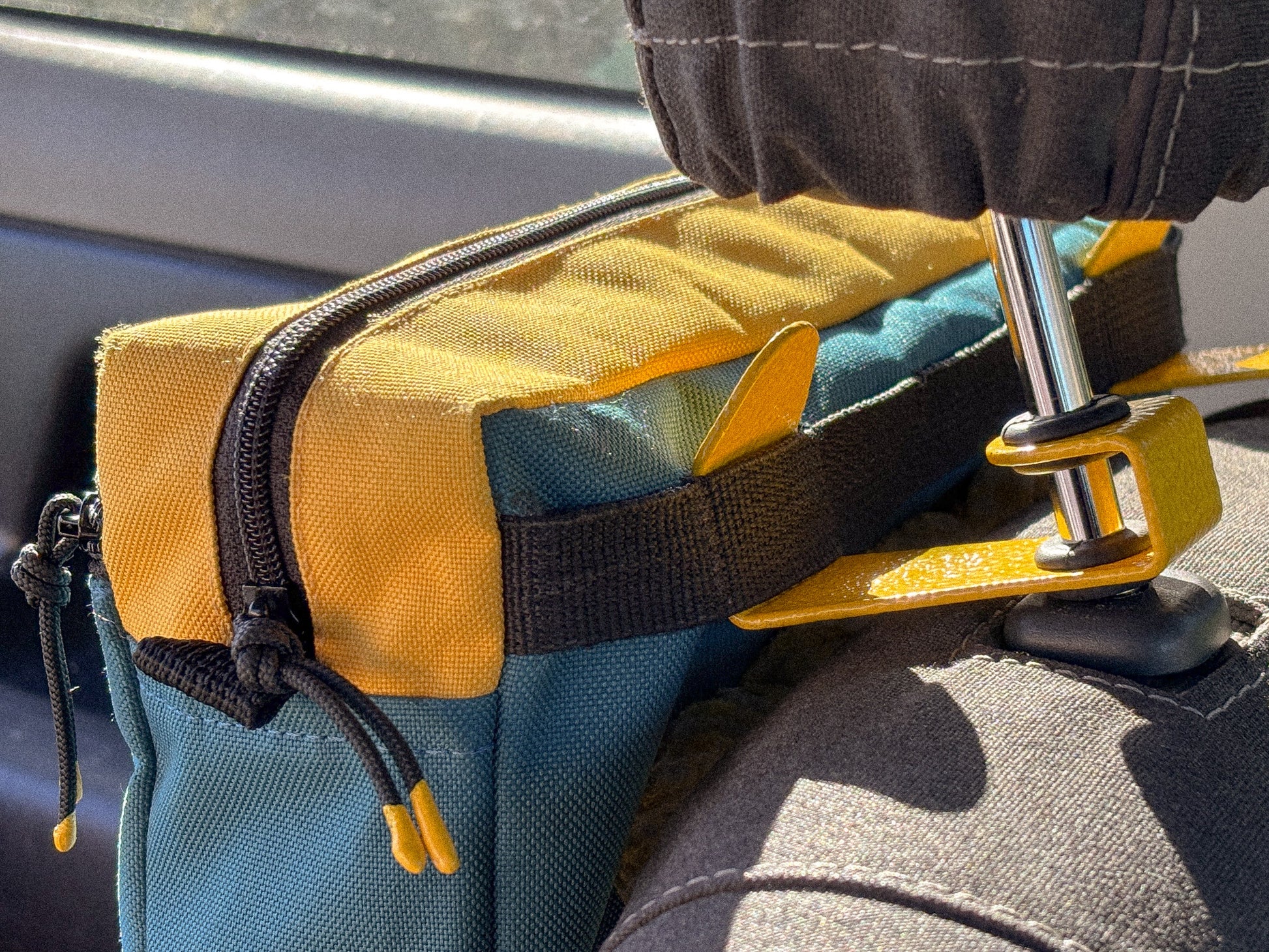 Yellow Seat Hooks on the headrest of a Suzuki Jimny 3