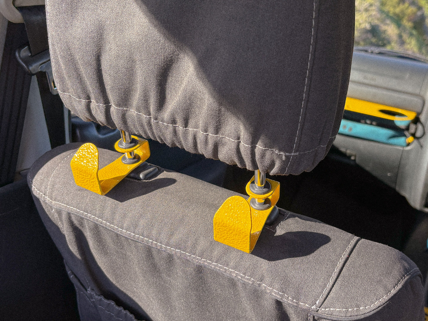 Seat Hooks on headrests to create extra storage