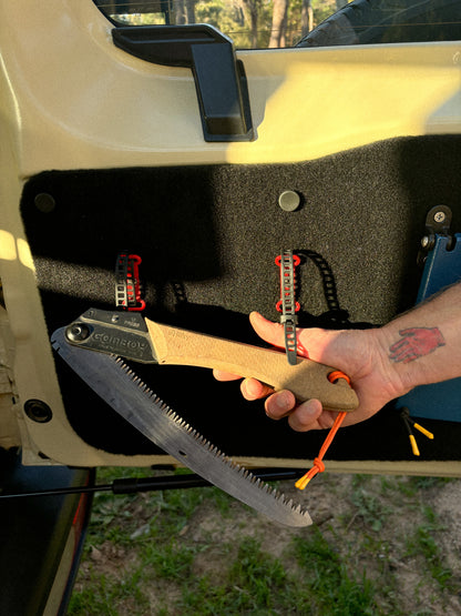 StrapOnz micro-cage cargo carrier in Red on Jimny 4 Rear Door Table Utility Panel with a saw